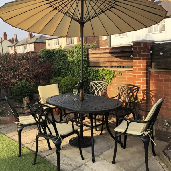 Customer photo of the June 6 seater garden table and chairs in antique bronze with stone cushions and parasol
