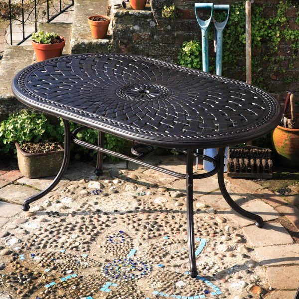 The June 6 seater garden table in antique bronze